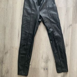 Slim fit faux leather pants. High waist